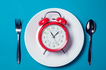 plate with an alarm clock on it